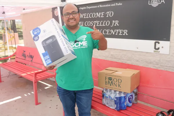 Photo of AFSCME Local 741 President holding an air purifier