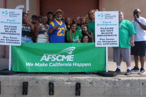 Group of people outside of Labor Community Services warehouse