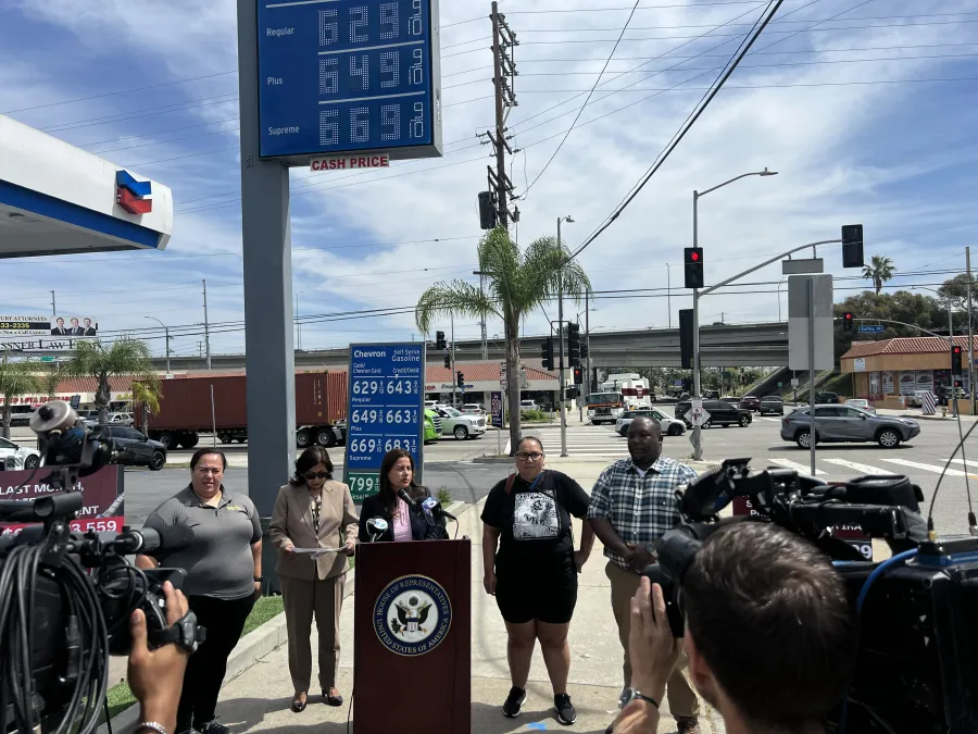 Photo from a press conference in front of a San Pedro gas station