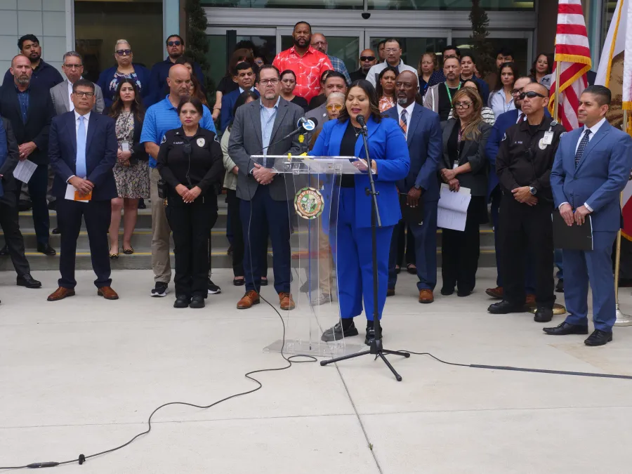 People at a press conference in Commerce, CA