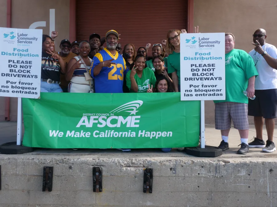 Group of people outside of Labor Community Services warehouse