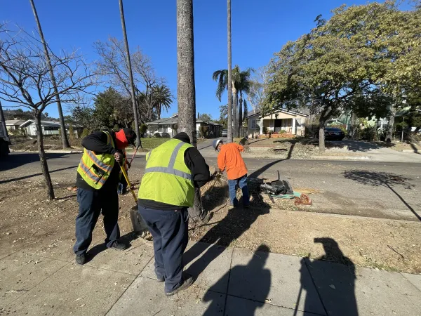 Image of Local 858 members cleaning debris after a wildfire.